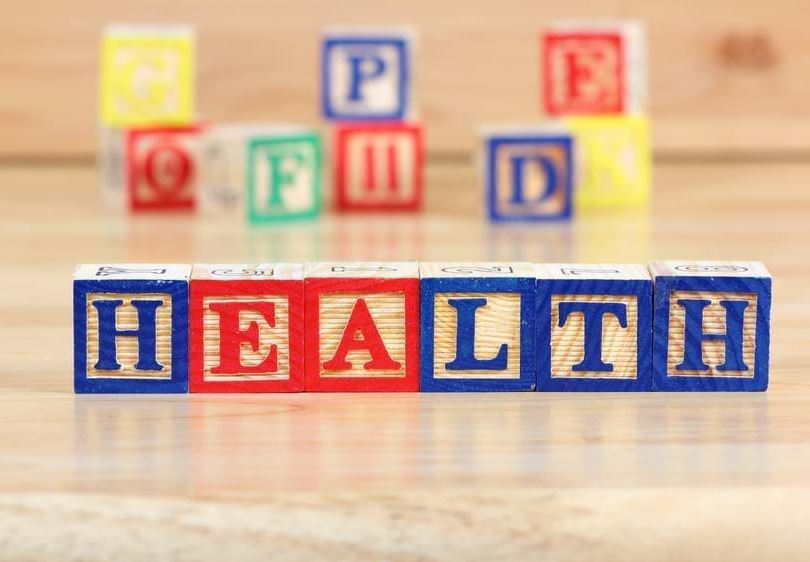 Letter block toys spell out the word 'Health'